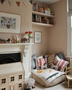 a living room filled with furniture and bookshelves next to a fire hydrant