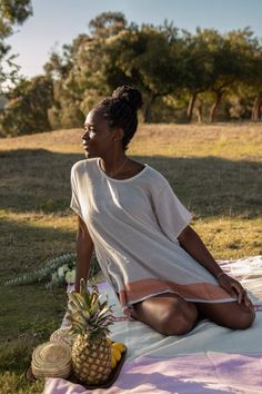 Swap your oversized tee for this semi-sheer cotton top that features a bold patterned hem with a rich sheen--a design inspired by Habesha Kemis, the traditional dress for Ethiopian women. About the Maker: Menby DesignFounded by Menbere Alemayehu, a native of Ethiopia committed to preserving traditional Ethiopian hand-weaving and hand-embroidery by introducing the techniques into pieces for the contemporary home and closet. Menby is dedicated to the economical empowerment of Ethiopian women throu Summer Tunic Tops For Loungewear, Bohemian Short Sleeve Tops For Loungewear, Traditional Summer Tunic Top, Traditional Tunic Top With Relaxed Fit, Bohemian Relaxed Fit Tunic Short Sleeve, Bohemian Relaxed Fit Short Sleeve Tunic, Casual Short Sleeve Tunic For Festival, Traditional Crew Neck Summer Top, Cotton Short Sleeve Tunic For Festivals