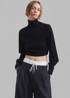 Color: Black Lightweight wool blend fabric Relaxed fit Cropped profile Turtleneck Balloon sleeves Rib knit trim Slip on style Unlined 50% Merino Wool 28% Polyester 22% Acrylic Dry Clean Imported Cropped Turtleneck, Balloon Sleeves, Merino Wool, Rib Knit, Wool Blend, Dry Clean, Turtle Neck, Slip On, Relaxed Fit