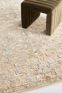 an area rug with a bench on top of it