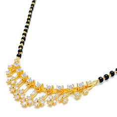 This 18k yellow gold Mangal Sutra, weighing 7.1 grams, features a tasteful dangling flower design adorned with 0.51 carats of diamonds in round and baguette shapes. The diamonds, with an F-G color and VS clarity, add exceptional brilliance and elegance. Complemented by traditional black beads, this necklace measures 19 inches in length with an additional 1-inch adjustable links. It is secured with a hook lock. Ideal for those who appreciate luxurious and sophisticated jewelry, this Mangal Sutra Yellow Gold Hand-set Diamond Necklace For Celebration, Dazzling Gold Hallmarked Diamond Necklace, Luxury Yellow Gold Diamond Necklace For Celebration, Traditional Yellow Gold Diamond Necklace With Hand-set Diamonds, Traditional Yellow Gold Diamond Necklace With Hand Set, Traditional Yellow Gold Diamond Necklace Hand Set, Traditional Hand Set Yellow Gold Diamond Necklace, Gold Diamond Necklace For Festive Occasions As A Gift, Luxury Diamond Necklace For Festive Season