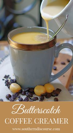 butterscotch coffee creamer is being poured into a cup filled with coffee beans