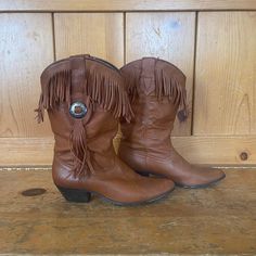 "^ Caramel Brown Fringe Leather Boots. These have fringe and conchos on the exterior sides and fringe around the top leg opening. These are light weight leather with a slight slouch. Modern Size: 7.5M Women's Vintage Size: 7.5M Content: 100% Leather Label: Acme Made in USA ^ Please note specific garment measurements below: Bottom of Sole Length: 10\" Height: 12\" Heel Height: 1.75\" * condition * Excellent Follow us on IG @bbwestvintage https://www.instagram.com/bbwestvintage/ I do not accept re Brown Fringe, Cowgirl Western, Caramel Brown, Leather Label, Western Boots, Boot Shoes Women, Cowboy Boots, Leather Boots, Womens Boots