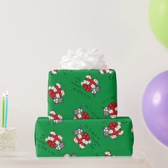 two wrapped presents sitting on top of a table