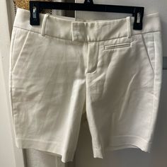 Calvin Klein 97% Cotton 3% Spandex Chic Stretch Mid-rise Shorts, Stretch Cotton Calvin Klein Bottoms, Calvin Klein Stretch Cotton Bottoms, Summer Pants With 5-inch Inseam, Fitted Mid-rise Shorts For Day Out, Fitted White Pants With Short Inseam, White Fitted Bermuda Shorts Casual, White Fitted Knee-length Shorts, Spring Calvin Klein Mid-rise Bottoms