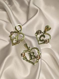 Who doesn't love a good gold initial in a heart ?!  A charm - 10kt gold - $128  C charm - 10kt gold - $128  B charm - 14KT gold Beverly Hills gold co. - $160 Anniversary Heart Charm Initial Pendant, Anniversary Heart Charm With Initial Pendant, Anniversary Heart Charm And Initial Pendant, 14k Gold Initial Pendant Charms For Anniversary, 14k Gold Charms For Valentine's Day Gift, Anniversary Initial Pendant Charms, 14k Gold Anniversary Charms With Initial Pendant, Gold Initial Pendant Charms For Anniversary, Initial Pendant Jewelry With Charms For Anniversary Gift