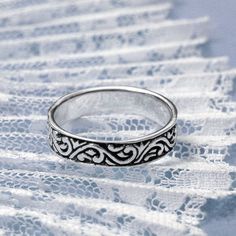 Inspired by an age of Chivalry and Romance, this ring looks like it might have been given by a knight to his lady love. Its simple elegance and timeless appeal are sure to win your heart. If you believe in true love and happily-ever-afters, this is the ring for you! The Silver Medieval Ring makes a beautiful statement all on its own. But if you like to go all out on your jewelry, try wearing it as a stack ring with other simple bands. The more, the merrier! Pagan Cross Stitch, Medieval Ring, Celtic Cross Stitch, Medieval Rings, Dragon Cross Stitch, The More The Merrier, Vine Ring, Leather Bound Journal, Simple Band