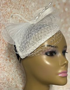 White Teardrop  Sinamay Fascinator Hat accented with veil netting, pearls, hat pin and rhinestones. The hat pin may vary. Perfect for church, weddings, funerals and special occasions. Hat measures approximately 6x8 inches. The hat affixes to the head by a hat elastic. Love what you see, but would like it in a different color, shape or size? Please contact us by sending a message. We offer custom hats in a variety of styles. PLEASE NOTE All items for Free Shipping will be shipped via USPS First C White Church Hats, Gold Fascinator, Special Occasion Hats, Church Lady Hats, Church Weddings, Sinamay Fascinator, Felt Headband, Mail Gifts, Bride Hat