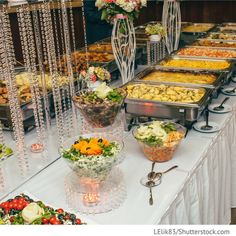 a buffet table filled with lots of food