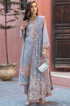 Elegant Ice Blue Heavily Embroidered Pakistani Salwar Kameez Dupatta Suit is a stunning attire that will give you an ethnic look on the big day. Premium quality fabric and lavish designs on this masterpiece make it the epitome of beauty and your foremost priority. Pakistani Kameez: The salwar kameez has an alluring ice blue color and it is emblazoned with embroidery and threads. The front of this purple kameez is intricately adorned with graceful designs, making it a perfect choice to wear on th Girls Attire, Kameez Designs, Pakistani Salwar, Dress Salwar Kameez, Pakistani Fancy Dresses, Pakistani Salwar Kameez, Desi Clothes, Trendy Fashion Tops, Pakistani Wedding Dresses