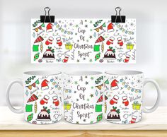 three coffee mugs with christmas designs on them