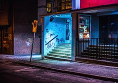 a building with graffiti on the walls and steps leading up to it's entrance