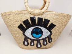 I love Mexico celebrates the native crafts of Mexico and the artists that produce them, enabling them and their communities to get recognized for their talented work and achieve economic stability for their families. This listing is for this bag shown on the picture, made of palm leaves and 100% natural materials. The bag comes with a sequin patch on the front side. The tassels or other accessories on the picture are not included. Measurements : please see pictures for exact size. All size units Bohemian Straw Bag For Beach Season Shopping, Embroidered Rectangular Crochet Bag For Summer, Embroidered Straw Tote Bag For Shopping, Woven Festival Bags For Beach Season, Summer Embroidered Rectangular Straw Bag, Woven Bags For Beach Festival Season, Woven Bags For Festival And Beach Season, Embroidered Beach Straw Tote Bag, Embroidered Straw Tote Bag For Beach