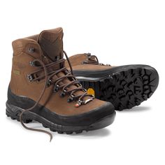 Rugged Waterproof Boots With Protective Metal Feet, Outdoor Leather Work Boots With Protective Metal Feet, Hiking Boots With Protective Metal Feet For Adventure, Insulated Gore-tex Lace-up Boots, Adventure Ankle Boots With Vibram Sole, Rugged Ankle Hiking Boots With Reinforced Heel, Brown Boots With Vibram Sole For Outdoor Activities, Brown Boots With Protective Metal Feet For Outdoor, Brown Waterproof Boots With Protective Metal Feet For Outdoor