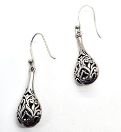 Filigree drop open work tribal Bali Balinese style sterling silver vintage drop earrings. Good vintage condition with little to no signs of normal vintage wear. Great patina present. Acid tests positive for sterling silver. Earrings measure 1 and 3/4ths of an inch tall and 1/2 of an inch wide. Bohemian Pierced Teardrop Earrings In Sterling Silver, Traditional Handmade Sterling Silver Teardrop Earrings, Handmade Traditional Silver Teardrop Earrings, Traditional Handmade Silver Teardrop Earrings, Handmade Silver Teardrop Earrings Vintage Style, Traditional Silver Teardrop Pierced Earrings, Bohemian Sterling Silver Filigree Teardrop Earrings, Bohemian Sterling Silver Teardrop Earrings With Intricate Design, Bohemian Silver Filigree Teardrop Earrings