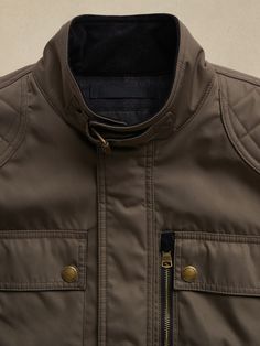 Moto imaginings flourish on this utilitarian style jacket inspired by earlier designs of the Royal Navy and reimagined in a super-sturdy recycled fabric.  Complete with a warm wool lining, quilted reinforcements to protect the shoulders and elbows, a Quilted Utility Jacket For Winter, Brown Moto Outerwear With Pockets, Casual Biker Jacket With Multiple Pockets For Outdoor, Functional Fall Outerwear For Urban Adventures, Outdoor Cotton Utility Jacket With Padded Collar, Quilted Cotton Outerwear For Outdoor, Moto Style Winter Outerwear With Padded Collar, Winter Moto Outerwear With Padded Collar, Military Style Outerwear With Padded Collar For Outdoor