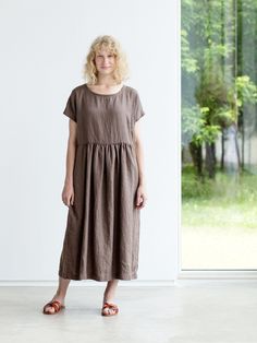 "Handcrafted Oeko-Tex Standard certified 100% European linen smock dress ideal for everyday wear. Perfect for springtime or chilly summer days. Always dress to kill! Neckline: round Silhouette: shift Length: ±48\"/120cm (we can make adjustments) Sleeve length: short Pockets: side seam Details: *Colour shown: moss green/ wood brown/ blue *Model is wearing size M *Medium weight *Maternity-friendly *Relaxed fit *Not-ironed (and no need to) *Handmade by @LinenCloud Easy care: - Machine wash gentle - Casual Brown Linen Dress With Relaxed Fit, Casual Brown Linen Maxi Dress, Brown Linen Dress For The Beach, Casual Flax Linen Dress For Daywear, Everyday Summer Linen Dresses, Casual Flax Daywear Dress, Casual Flax Color Daywear Dress, Casual Flax Dress For Daywear, Casual Flax Color Dress For Daywear