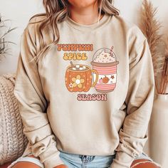 Get cozy this autumn with our Fall Coffee Sweatshirt! Perfect for celebrating your favorite fall flavor, this comfy and stylish sweatshirt is a must-have for the cooler months. Whether you're sipping on a hot coco, enjoying a crisp walk, or just lounging at home, this sweatshirt will keep you warm and fashionable. This Fall Coffee Sweatshirt makes an excellent gift for family, friends, or anyone who loves autumn. It's ideal for birthdays, special occasions, or just because. Show your love for al Cute Relaxed Fit Sweatshirt For Fall, Cute Cozy Fit Tops For Fall, Cute Fall Loungewear Sweatshirt, Pumpkin Sweater, Pumpkin Spice Shirt, Teacher Sweatshirt, Coffee Tees, Hot Coco, Coffee Sweatshirt