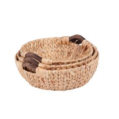 two woven baskets with wooden handles on white background