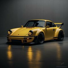 a yellow sports car parked in a dark room