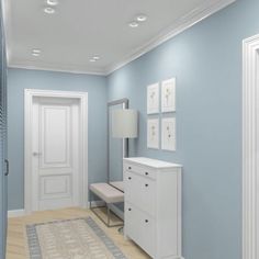 an empty room with blue walls and white trim on the door, carpeted floor