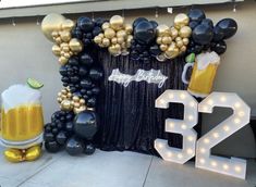 balloons and decorations for a birthday party with beer mugs on the front door, number 32