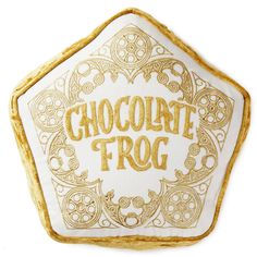 a white and gold cookie with the words chocolate troq written in gold on it