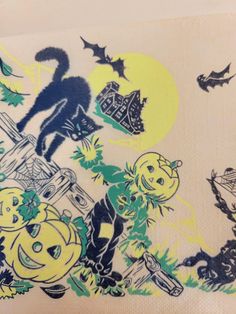 an image of a halloween scene with cats and pumpkins on the table cloth that has been drawn onto