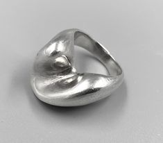 "A wonderful sterling silver modernist ring with smooth, flowing lines.  The ring measures almost 3/8\" high from the finger, and weighs 11 grams. Beautiful quality, the design is very distinct, edges smooth and a very solid feel.  There are no markings on the ring, but it has been appraised and tested as .925 Sterling.  Current ring size: 5.5  Statistics: Size 5.5 Weight: 11 Grams Metal:  Sterling Purity:  .925" Modernist Ring, Unusual Rings, Modernist Jewelry, Contemporary Ring, Stacked Jewelry, Wave Design, Ring Collections, Silver Band, Rings Statement