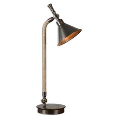 a lamp that is on top of a wooden base and has a metal pole attached to it