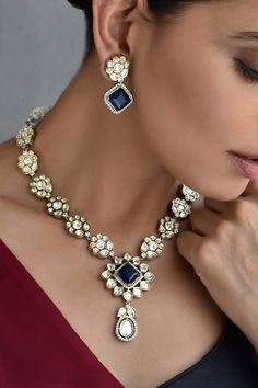 Silver toned necklace embellished with polki and blue stone. Comes with a pair of matching earrings. - Aza Fashions Blue Jewelry Set, Jewellery Sets, Blue Jewelry, Brass Color, Blue Stone, Aza Fashion, Matching Earrings, Online Jewelry, Necklace Set