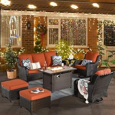 an outdoor living room decorated with christmas lights