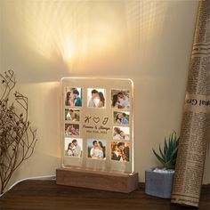 an illuminated photo frame with photos on it