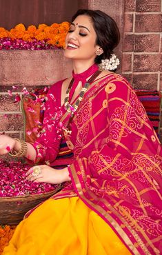 This Saree is Ready to Wear (With Fall and Pico Done). A designer saree in Magenta & Yellow color. It has intricate design all over the saree. This saree is a suitable amalgamation of style and grace that is required from an ethnic wear. The saree is ideal for any formal gathering. The saree comes with an unstitched blouse of corresponding color and design as shown in the picture. Georgette Designer Red & Yellow Color Saree Fabric Type: GeorgettePrimary Color: MagentaSecondary Color(s): - Yellow Pre-draped Georgette Saree For Puja And Eid, Celebration Saree With Bandhani Print And Traditional Drape, Festive Bandhani Print Georgette Pre-draped Saree, Festive Semi-stitched Pre-draped Saree For Puja, Bandhani Print Saree For Navratri Celebration, Festive Georgette Sets With Bandhani Print, Festive Bandhani Print Georgette Sets, Multicolor Bandhani Print Pre-draped Saree For Wedding, Festive Semi-stitched Bandhani Print Choli