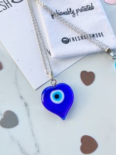 Handmade and one of a kind. Straight from the MediterraneanSea. The gorgeous BEAUTIFUL one of a kind Glass Evil Eye heart amulets will reflect any negative energy with its striking eye. A traditional yet timeless necklace curated for the modern fashionista. Chain Necklaces are 16kt gold plated over brass measuring a 17.5 inch length. This chain is higher quality than my usual charm chains. I had to upgrade it for this unique statement charm. Limited quantities special made for Valentine's Day. T Evil Eye Blue, Glass Heart Necklace, Timeless Necklace, Glass Evil Eye, Protection Jewelry, Eye Glass, Pretty Packaging, Glass Bracelet, Amulets