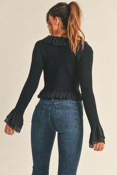 The Erica Knit Top is a stylish wardrobe staple. It features a ribbed sweater knit fabric and an open crop top with woven ruffle trim detailing. Perfect for a fun date night or any occasion, this top is comfortable and fashionable. 52% Viscose 28% Polyester 20% Nylon Open Crop Top, Tie Sweater, Dinner Dates, Stylish Wardrobe, Black Leather Pants, Ruffle Long Sleeve, Knit Crop Top, Knit Crop, Sweater Knit