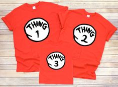 Just in time for Halloween! Dress up your crew in these adorable tees! Red cotton T-shirt or baby bodysuit has Thing 1 (or Thing 2,3,4,5,6) graphic in high quality HTV. Available in baby bodysuits, toddler, youth and adult sizes tees. Onesies and Toddler sizes are Rabbit Skins.  Youth & Adult sizes are Gildan. Funny Red Tops With Cartoon Print, Funny Red Top With Character Print, Funny Red Tops With Character Print, Themed Red Short Sleeve Tops, Red Themed Short Sleeve Tops, Fitted Red Top For Birthday, Red Fitted Top For Birthday, Thing 1 And Thing 2, Halloween Dress