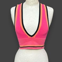 Elevate your casual and travel outfits with this stunning Urban Outfitters Josie Ribbed V-Neck Vest Top. The hot pink with the black and orange stripe design is perfect for a festival, sport event. Made from a comfortable polyamide blend with spandex fabric type, this top features seamless construction and wide strap sleeve type. The cute sleeveless top with a V-neckline and pullover closure is machine washable, making it easy to care for. Its small medium size type that will flatter any figure, Travel Outfits, Cropped Style, Vest Top, Sport Event, Black Orange, Travel Outfit, Spandex Fabric, Stripes Design, Orange Black