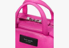 Puffed up yet practical this satchel features a crossbody strap to go hands-free along with pockets to keep you organized. | Kate Spade Puffed Satchel, Vivid Snapdragon Kate Spade Luxury Rectangular Satchel, Pink Handheld Satchel With Single Handle, Elegant Pink Kate Spade Satchel, Kate Spade Pink Satchel, Kate Spade Satchel With Detachable Handle For On-the-go, Nappa Leather, Crossbody Strap, Kate Spade New York, Continental Wallet