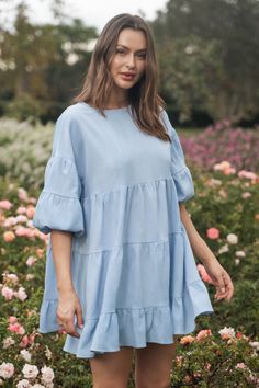 Introducing our Light Blue Puff Sleeve Ruffled Mini Dress, a delightful blend of charm and sophistication. Crafted from soft and airy fabric, this dress features romantic puff sleeves that add a touch of drama, while the ruffled detailing lends a playful and feminine flair. The light blue hue evokes a sense of freshness and tranquility, perfect for brightening up any occasion. Product code: CAA05A4C218SS Features:  Woven Round neckline Short puff sleeves Ruffled hem Mini Wash Method: Regular Was Flowy Puff Sleeve Dress With Ruffle Hem, Flowy Short Sleeve Puff Dress With Ruffle Hem, Feminine Flowy Puff Sleeve Dress With Ruffle Hem, Spring Puff Sleeve Mini Dress With Ruffles, Chic Tiered Ruffle Sleeve Dress For Spring, Brunch Puff Sleeve Dress With Ruffle Hem, Puff Sleeve Dress With Ruffle Hem For Brunch, Chic Tiered Dress With Ruffle Sleeves For Spring, Flowy Lantern Sleeve Dress With Ruffles