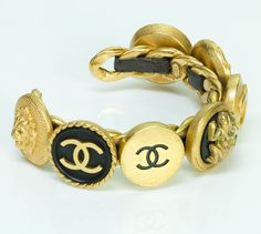 Chanel Charm Bracelet Vintage Chanel bracelet with multiple charms. Rare Chanel leather/gold plated charms cuff from Spring/Summer 1995 collection in very good condition. Measurements: Diameter 2.3" Made in: France Thanks for viewing this item: we have more Chanel jewelry here. Chanel Jewelry Luxury Vintage Bracelets For Festivals, Luxury Vintage Link Bracelets, Luxury Vintage Metal Charm Bracelet, Luxury Vintage Gold Charm Bracelet, Chanel Charms, Chanel Charm Bracelet, Chanel Cuff Bracelet, Chanel Charm, Vintage Chanel Jewelry