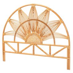 the headboard is made out of bamboo and has an intricate fan design on it