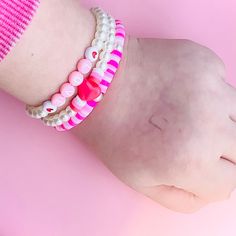 handmade Valentines bracelet with pearls and pink, white and red beads with heart smiley face with a white elastic string kids/women's bracelet Playful White Adjustable Bracelets, Playful Adjustable White Bracelets, Playful White Wristband For Friendship, Playful White Adjustable Beaded Bracelets, Playful Adjustable White Beaded Bracelets, Playful Adjustable White Beaded Bracelet, Cute White Pearl Bracelet With Colorful Beads, Cute White Bracelets With Colorful Beads, Playful White Beaded Bracelets