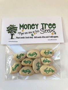 money tree seed seeds in plastic bag on white tablecloth with green writing and dollar signs