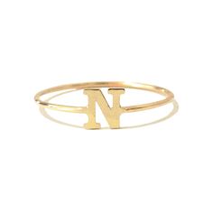 This unique initial letter cut-out is composed of 14K solid gold and beautifully complemented by a durable 14K solid gold band. Initial Letter Dimensions: approximately 5mm (w) x 5mm (h) Band Thickness: approximately 1.25mm Metal Finish: High Shine Polish This design is available in Rose, White and Yellow 14K Gold Please note that this item takes about 1 to 3 business days for production, prior to shipping. This item is proudly made in USA. *This piece comes in a Nana Bijou branded white leather Classic Yellow Gold Initial Ring With Name, 14k Yellow Gold Monogram Initial Ring, Monogrammed 14k Yellow Gold Initial Ring, Everyday 14k Gold Monogram Ring, Personalized Initials 14k Gold Rings, Personalized 14k Gold Rings With Initials, Monogrammed Yellow Gold Rings As Personalized Gift, Classic 14k Gold Initial Ring For Personalized Gift, Custom Alphabet