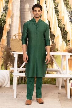 Bottle green kurta with mandarin collar and full sleeves. Paired with solid straight pant.
Components: 2
Pattern: Plain
Neckline: Mandarin Collar
Sleeve Type: Full Sleeves
Fabric: Glaze Cotton, Chanderi Cotton
Color: Green
Other Details: 
Front half button placket
Occasion: Sangeet,Mehendi and Puja - Aza Fashions Collar Kurta, Salwar Pants, Kurta Set For Men, Chinese Collar, Smen, Ethnic Design, Bottle Green, Kurta Set, Full Sleeves