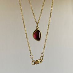 Whimsical yet tantalizing, this foliage-shaped garnet is simply unforgettable. 22k & 18k yellow gold Rhodolite garnet 7mm x 10mm (1/4" x 7/16")1.3mm cable chain is adjustable and can be worn at 17" or 20" Fine Jewelry Yellow Gold Garnet Necklaces, Formal Yellow Gold Tourmaline Necklaces, Formal Yellow Gold Tourmaline Necklace, Yellow Gold Ruby Teardrop Necklace, Teardrop Ruby Jewelry In Yellow Gold, Teardrop Ruby Necklace In Yellow Gold, Yellow Gold Teardrop Ruby Necklace, Yellow Gold Garnet Necklaces With Oval Shape, Yellow Gold Oval Garnet Necklace