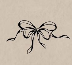 a black bow on a beige background with the word love written below it in cursive writing