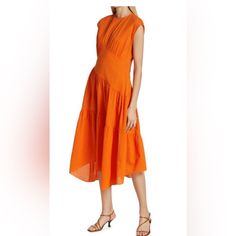 Frame Orange Dress - Nwot Size Small Orange Crafted Of Seersucker, Frame's Cap-Sleeve Midi-Dress Is Woven From Pure Cotton. A Gathered Bodice Complements The Style's Tiered Skirt And Asymmetric Hem. Jewel Neckline Cap Sleeves Concealed Back Zip Asymmetric Hem 100% Cotton Machine Wash Imported Size & Fit About 49" From Shoulder To Hem Model Measurements: 5'10" Tall Model Is Wearing A Us Size Small Summer Workwear Orange Midi Dress, Orange Midi Dress For Summer Workwear, Summer Orange Midi Dress For Workwear, Summer Workwear Ruched Midi Dress, Ruched Midi Dress For Summer Workwear, Summer Orange Pleated Midi Dress, Gathered Bodice, Shirt Dress Summer, Denim Dresses