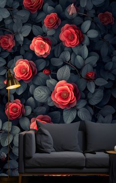 a living room scene with focus on the sofa and wallpaper that has red flowers